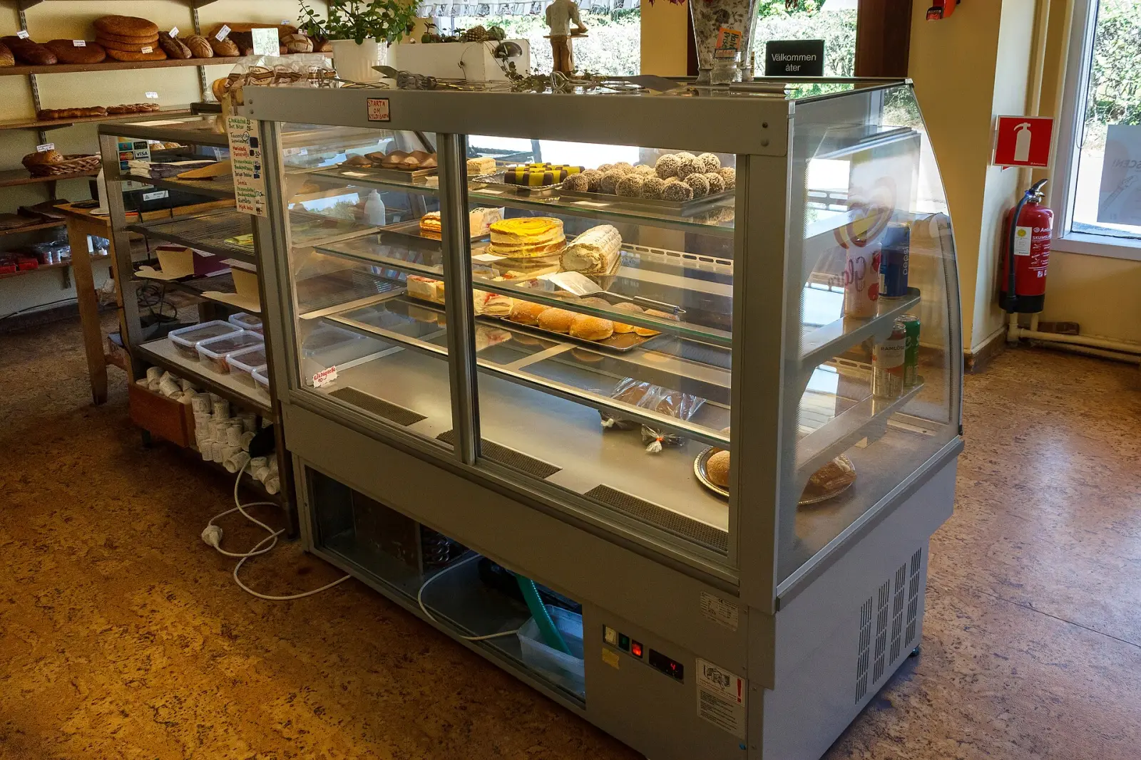 Cakes and pastries in a bakery display case. The photo was not taken in Boca Raton.