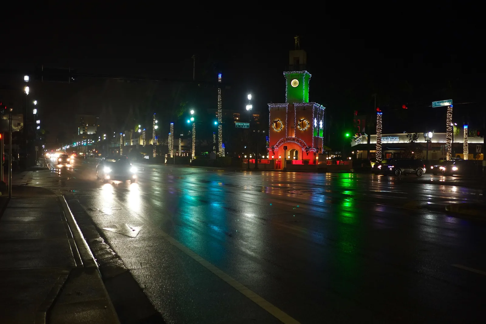 Royal Palm Place and its clock tower lit up at night on Federal Highway in downtown Boca Raton.