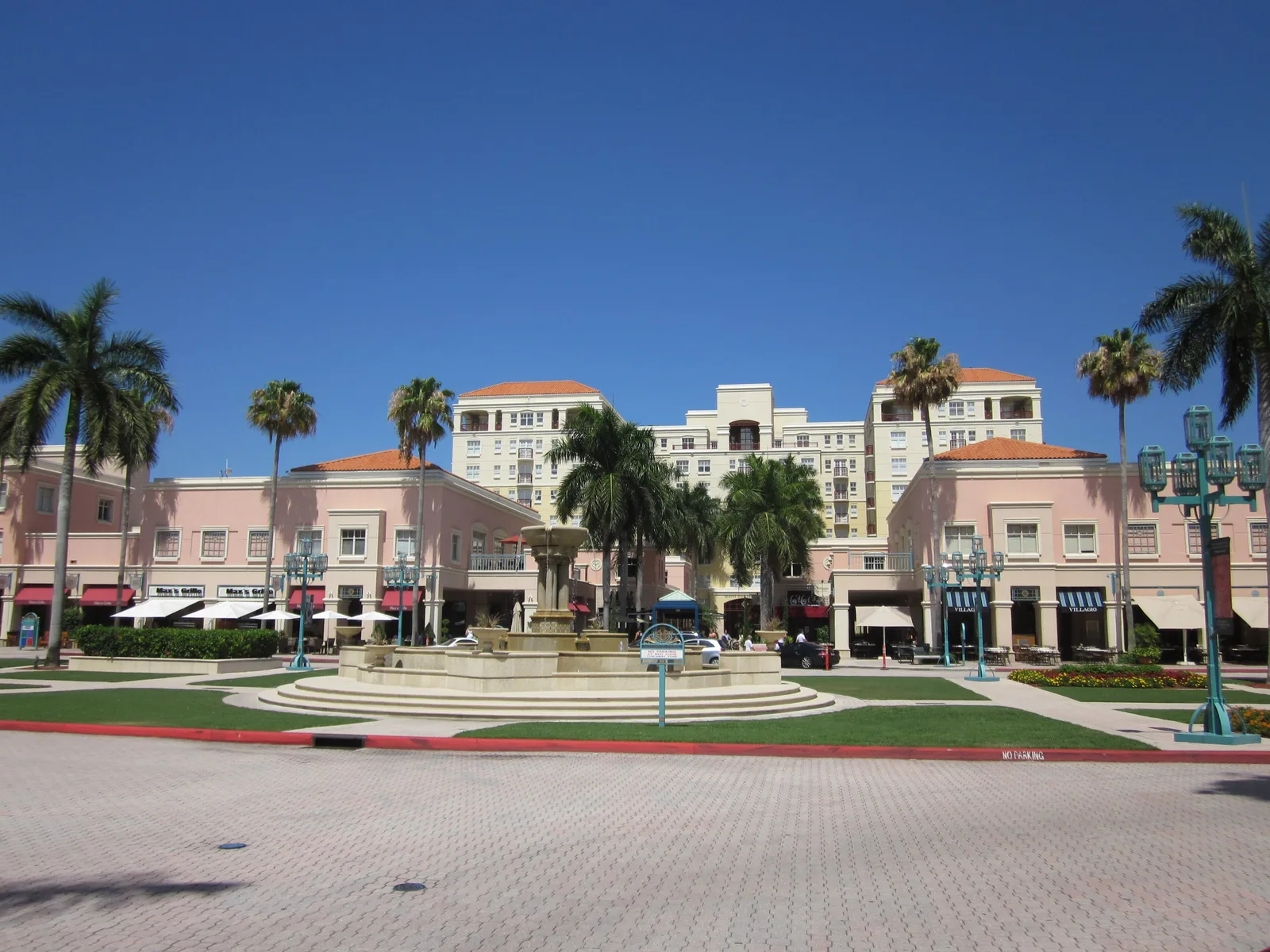 The fountain lawn and storefronts of Mizner Park in downtown Boca Raton.