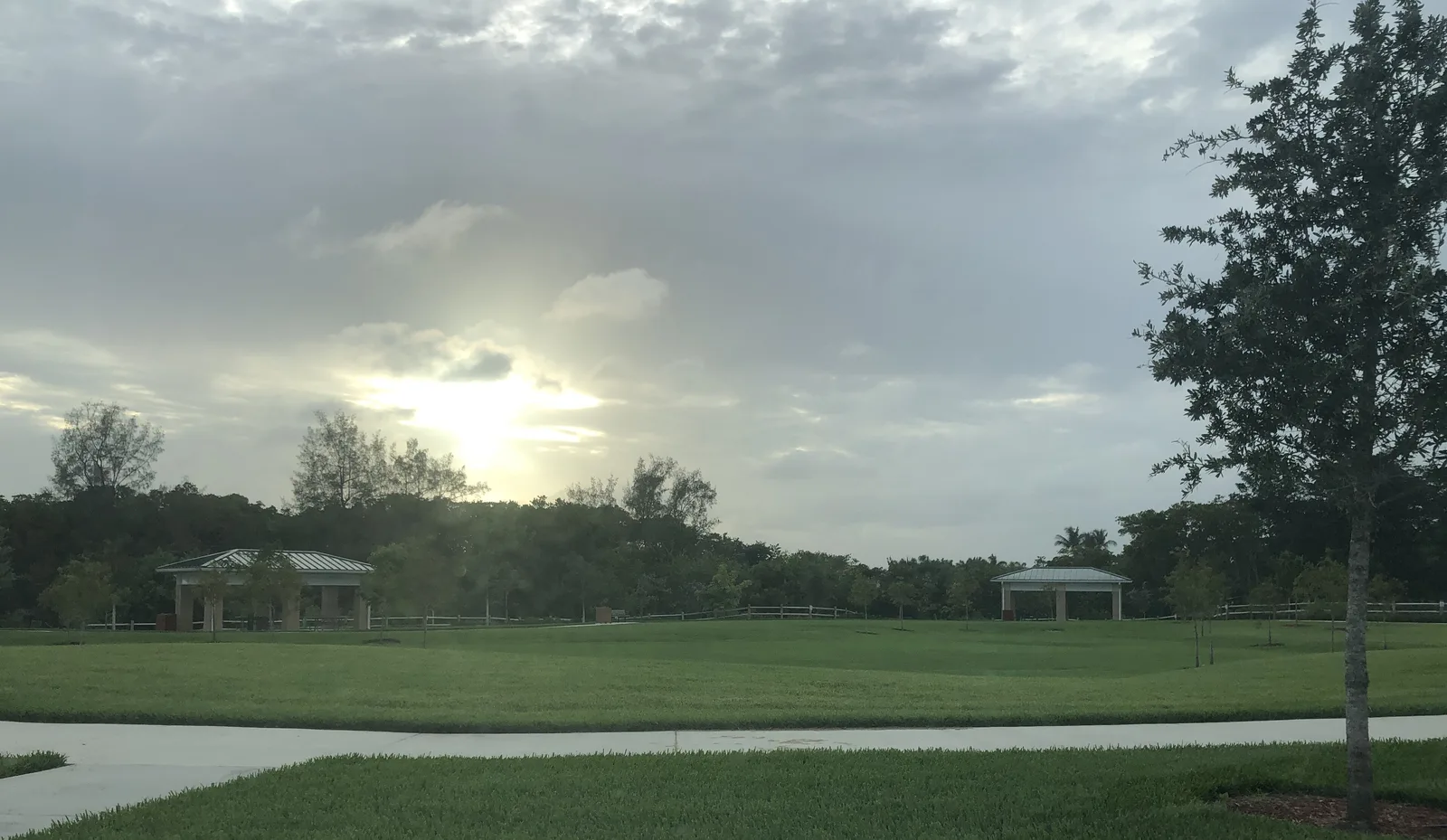 The sun over the open lawn at Hillsboro El Rio Park South in Boca Raton.